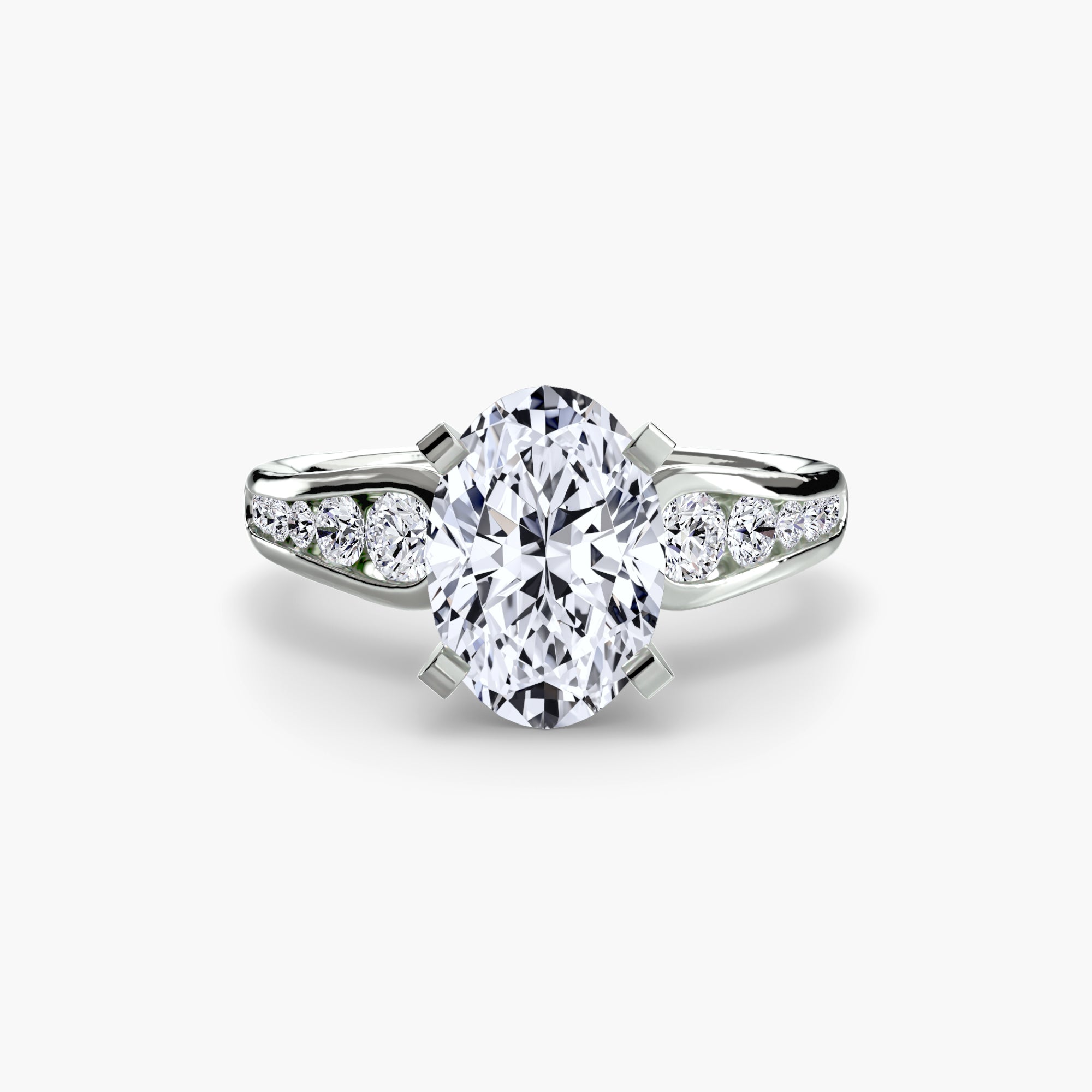 The MICHAEL ISAAC Solitaire with Pavé 2 features a white gold band with a large oval diamond and three smaller round diamonds on each side, exemplifying everyday luxury against a plain white background.