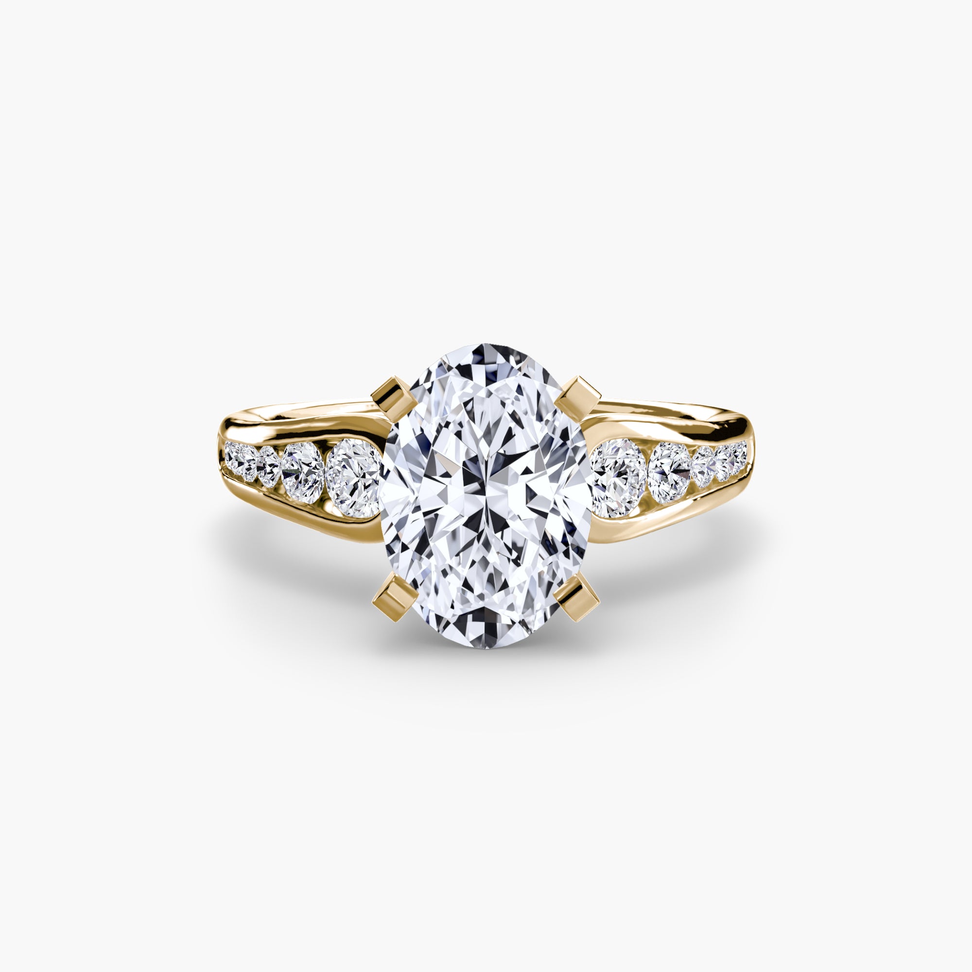 The MICHAEL ISAAC Solitaire with Pavé 2 is a gold ring with an oval diamond center and pavé-set round diamonds on the band, offering everyday luxury against a white background.