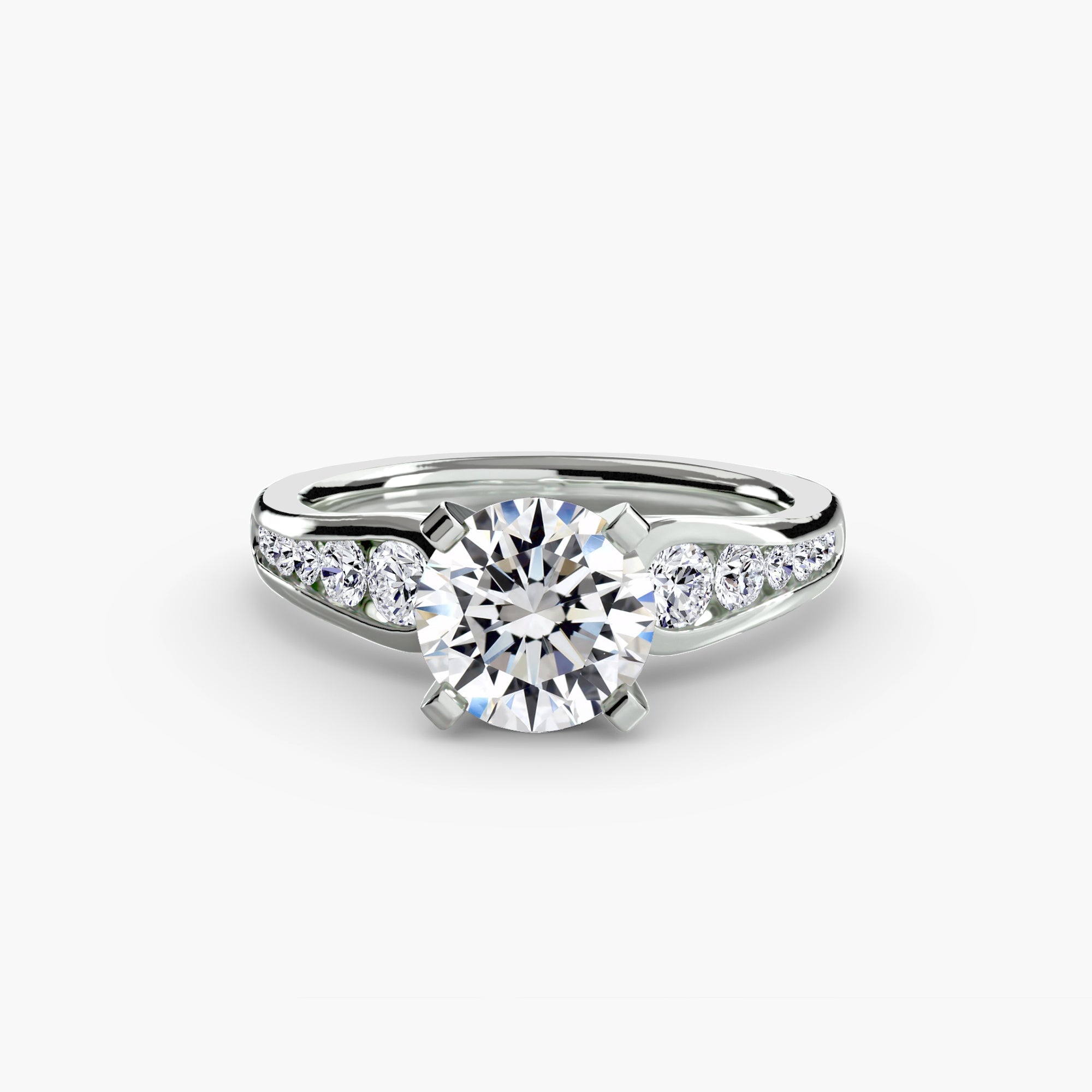The MICHAEL ISAAC Solitaire with Pavé 2 ring features a large round diamond in a white gold four-prong setting, accented by pavé-set diamonds along the band, creating an elegant statement of everyday luxury.
