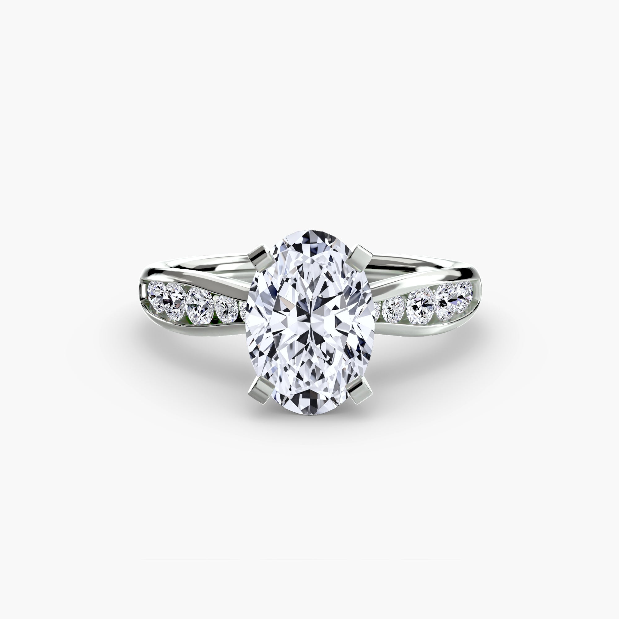 The Solitaire with Pavé 3 by MICHAEL ISAAC is a silver ring featuring an oval-cut clear center stone, accented by three smaller round stones on each side, capturing everyday luxury against a plain white background.