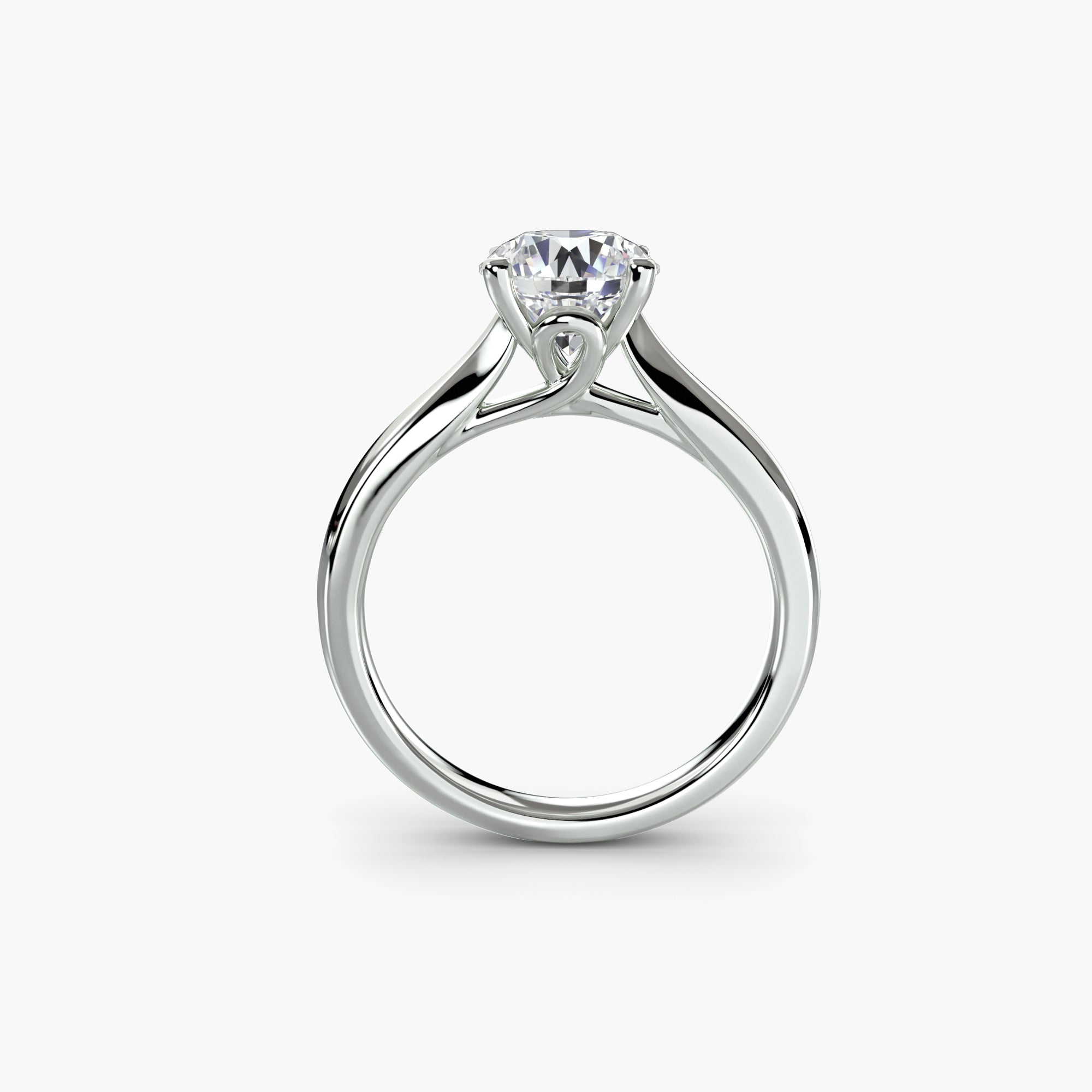 The MICHAEL ISAAC Solitaire ring 3 showcases a round brilliant diamond in a classic setting on a minimalist platinum band, displayed against a plain white background.