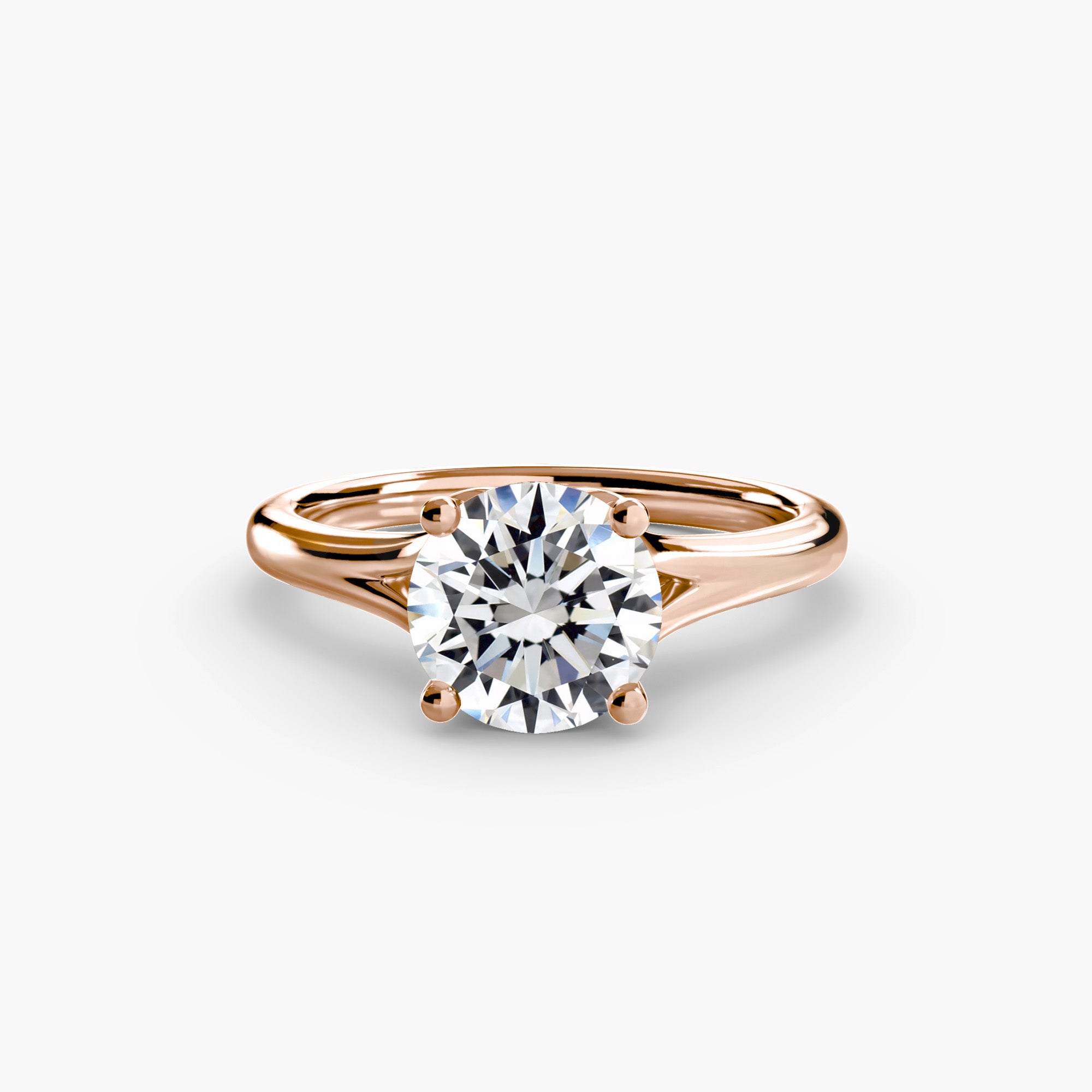 The MICHAEL ISAAC Solitaire ring 4 is a rose gold solitaire ring featuring a round-cut diamond in a classic four-prong setting, displayed on a plain white background.