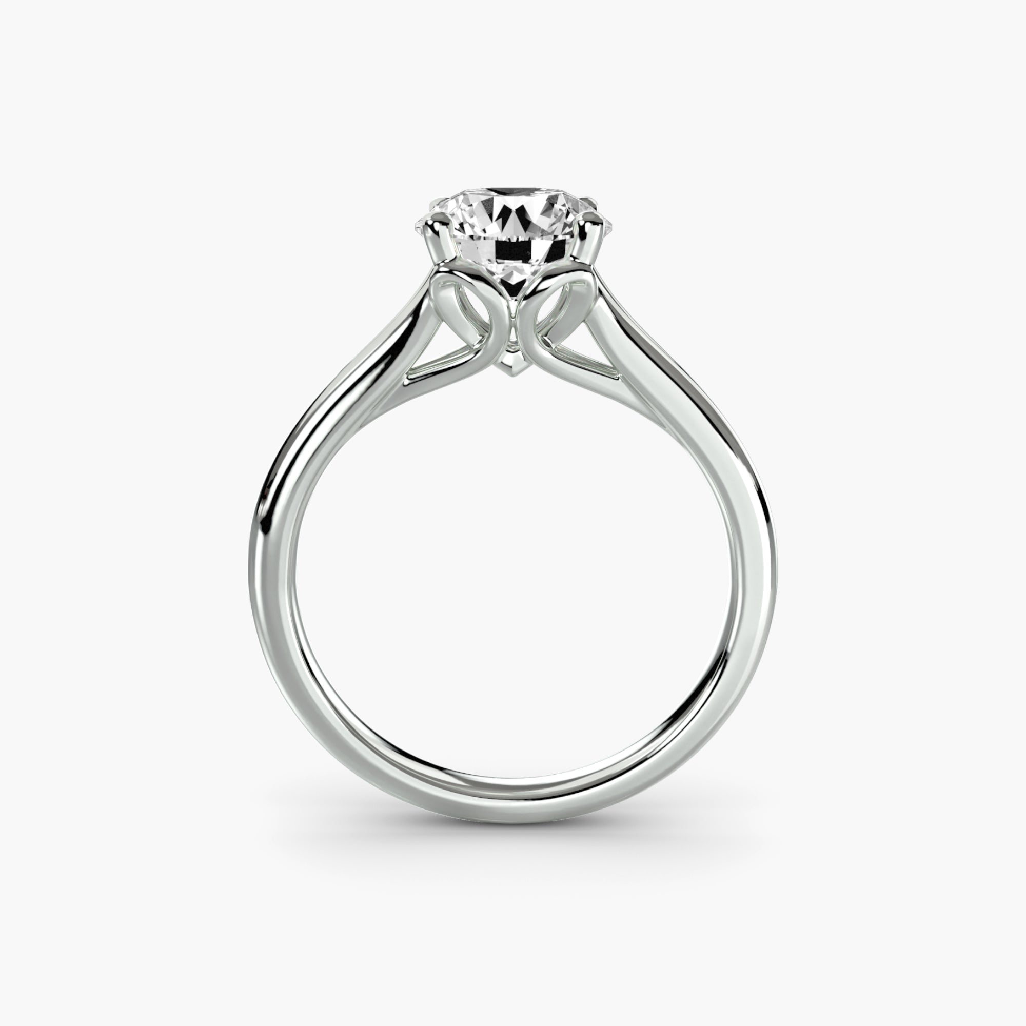 A close-up side view of the MICHAEL ISAAC Solitaire ring 4 shows a round-cut diamond in a prong setting with delicate, curved detailing beneath the stone.