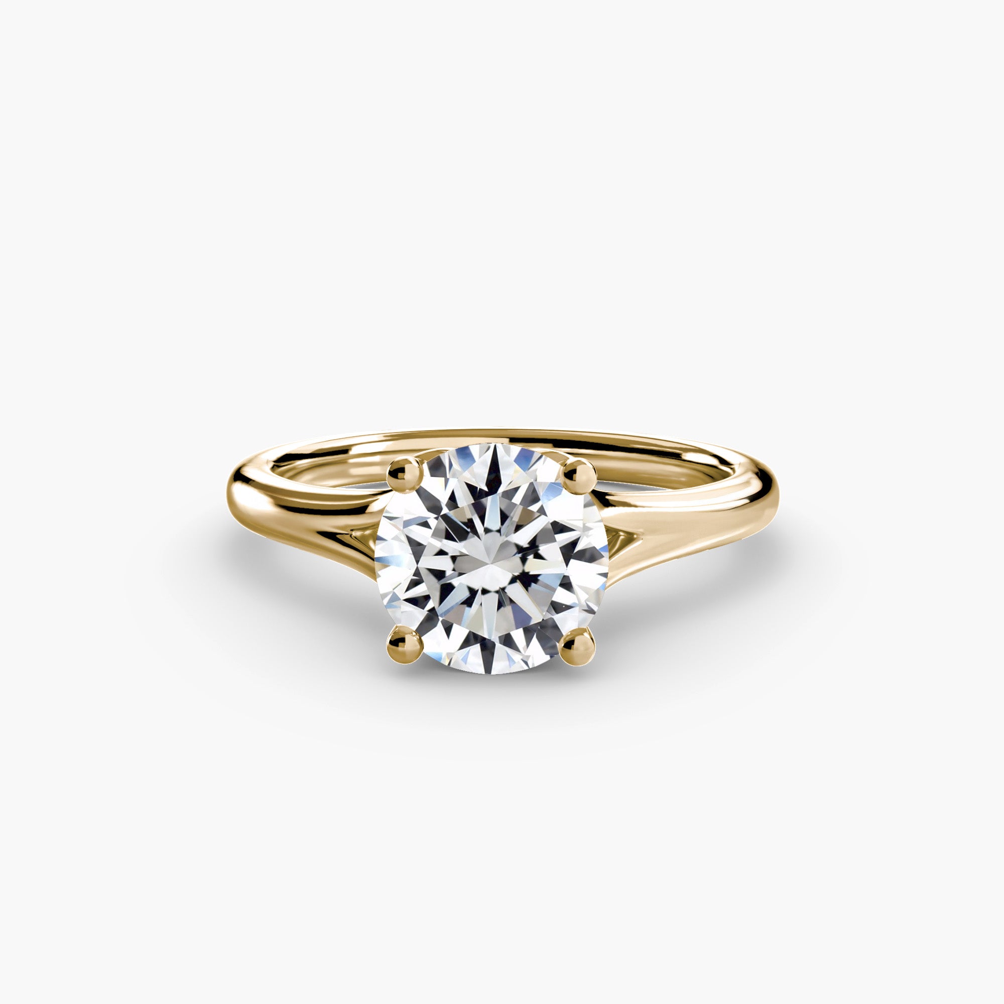 The MICHAEL ISAAC Solitaire Ring 4 features a round, brilliant-cut diamond in a classic four-prong gold setting, shown on a white background for a timeless minimalist look.