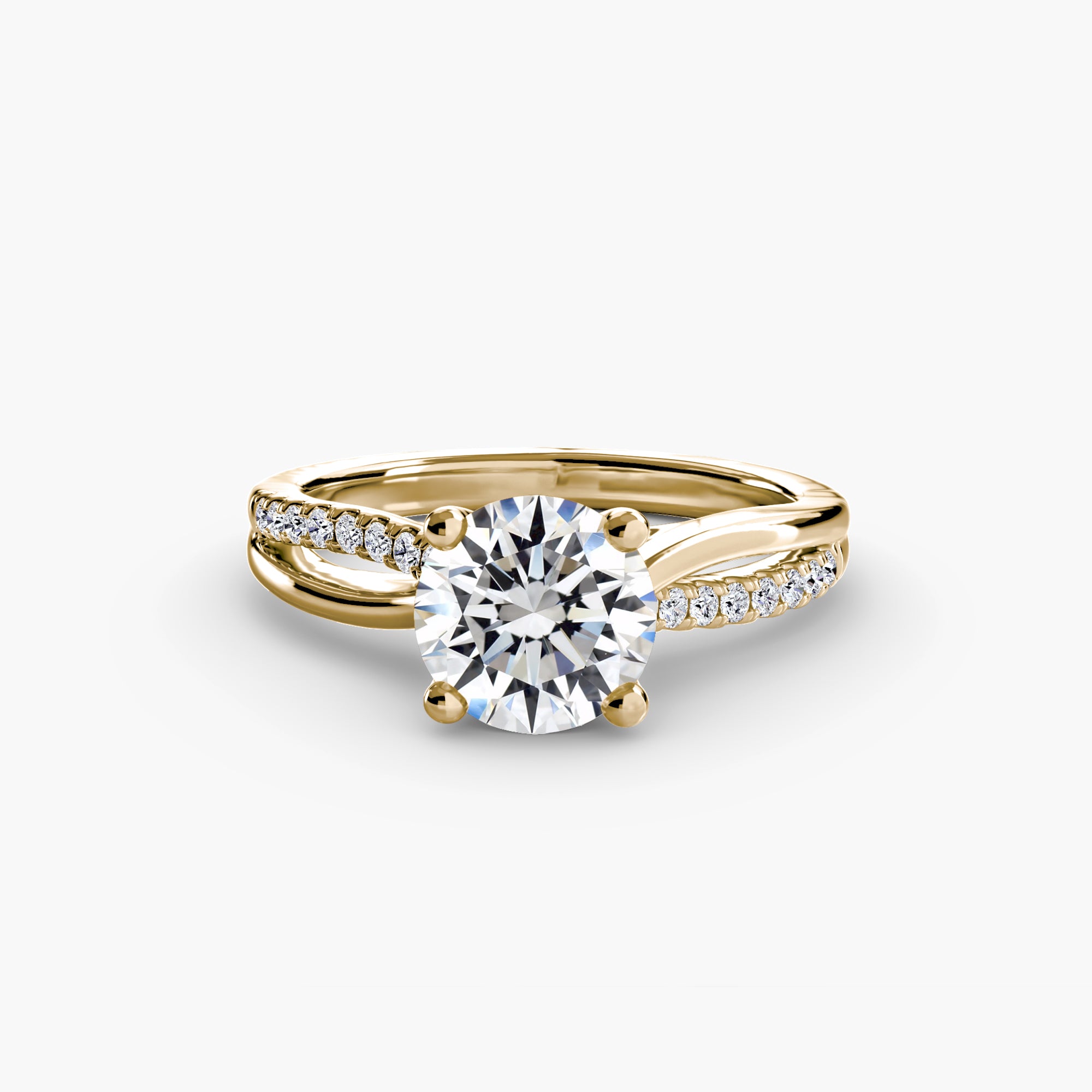 The Split Shank Pavé Solitaire by MICHAEL ISAAC features a gold band with pavé-set diamonds along the split shank and a large round diamond center, offering everyday luxury against a plain white background.