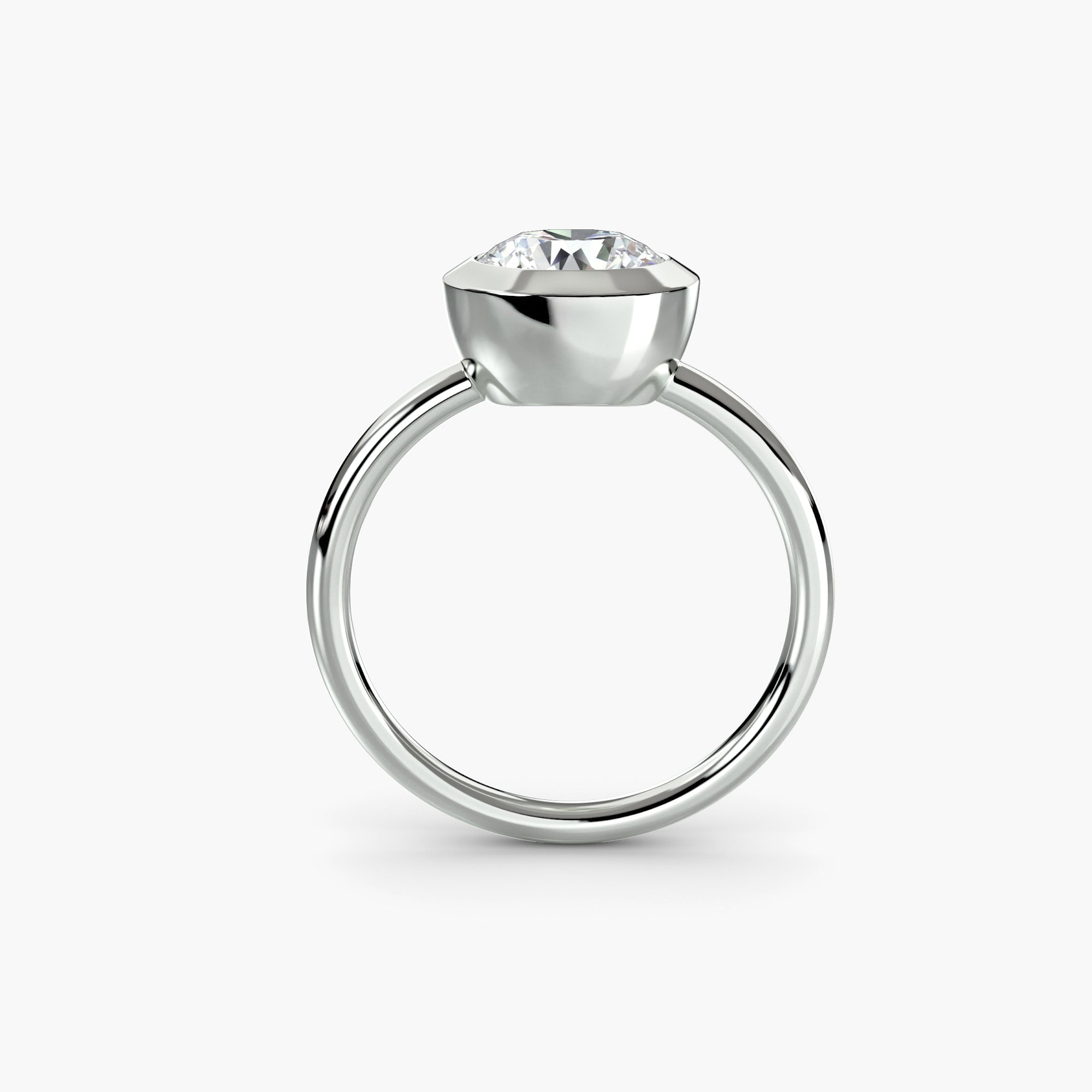 The Bezel Set Solitaire by MICHAEL ISAAC is a minimalist silver ring with a round diamond in a classic solitaire setting, shown on a plain white background.