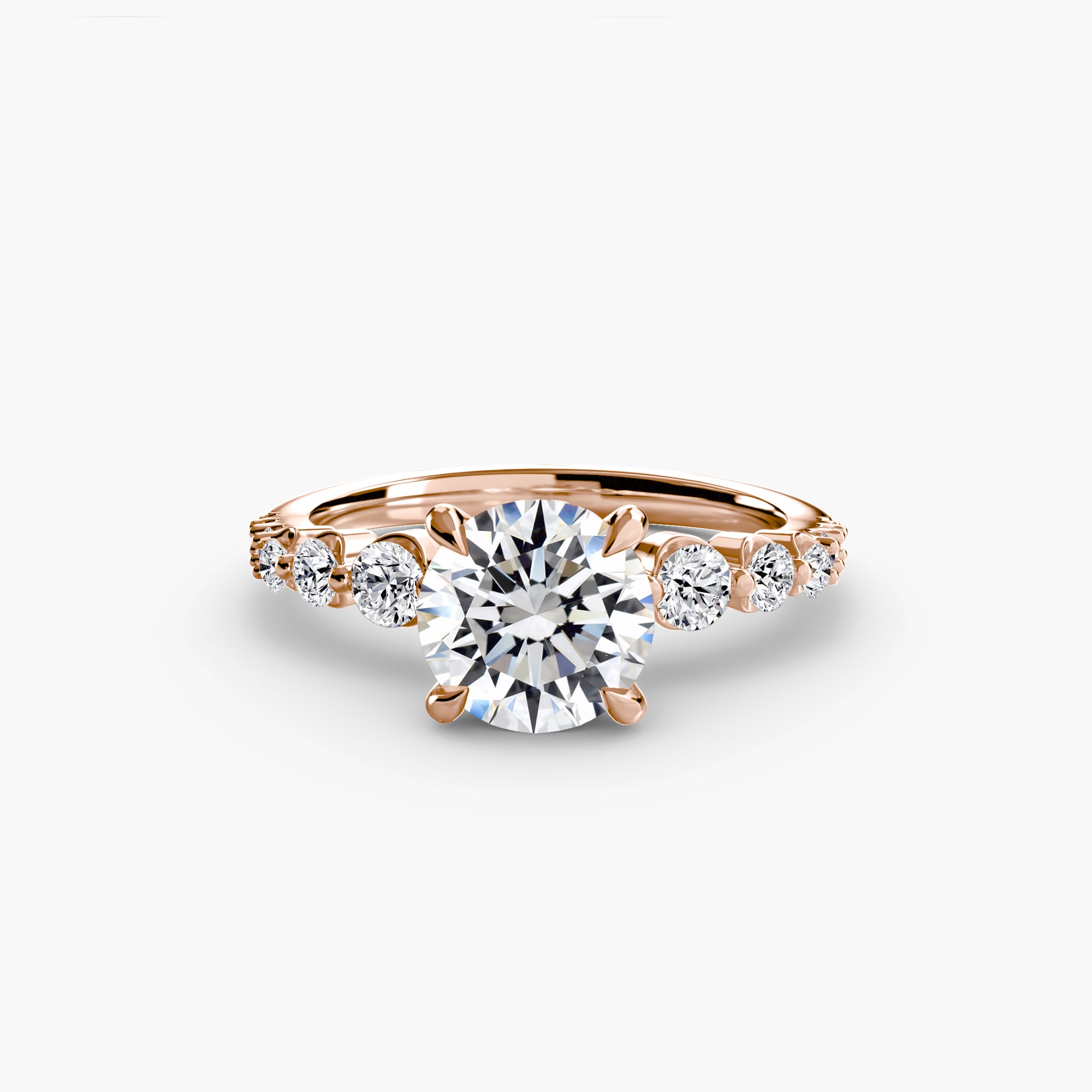 The Cascade Diamond Ring by MICHAEL ISAAC features a 1.5 ct center stone in rose gold with sparkling side stones along the band, showcased on a plain white background.