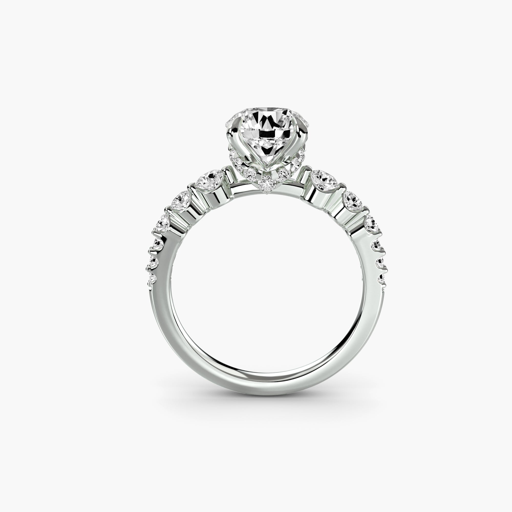 The Cascade Diamond Ring by MICHAEL ISAAC features a large heart-shaped center stone with sparkling side stones on a sleek silver band, shown on a plain white background.