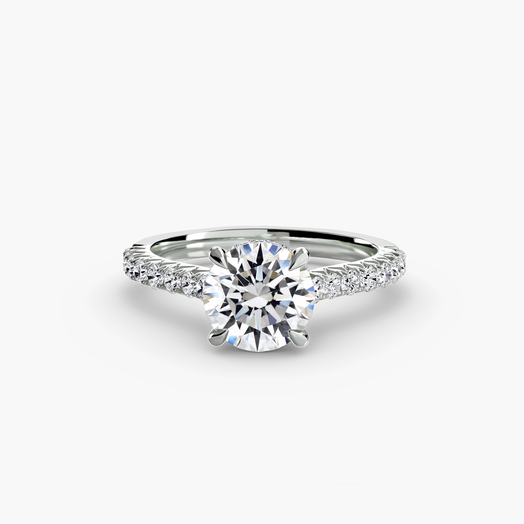 The MICHAEL ISAAC Solitaire with Pavé 5 is a silver ring showcasing a large round center diamond and pavé-set diamonds along the band, displayed on a white background—an exquisite everyday luxury.
