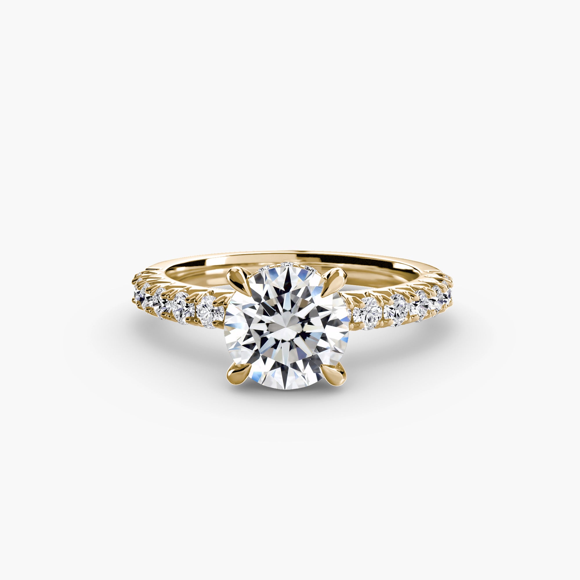 The Solitaire with Pavé 6 by MICHAEL ISAAC is a gold solitaire ring with a large round diamond center and pavé-set band, exuding everyday luxury, shown on a plain white background.